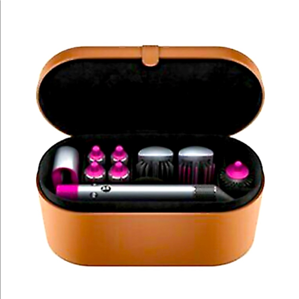 Dyson hair dryer with full set of attachments and leather case. Used once.